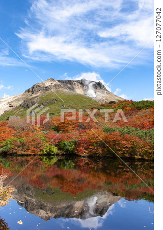 Autumn leaves seen from Hyotan Pond on Mount Nasudake 127077042
