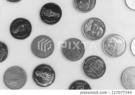 Scattered Coins on white background 127077344