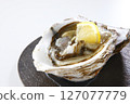 Seasonal rock oysters on a white background 127077779