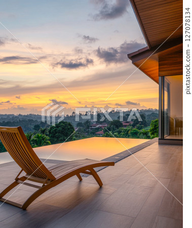 Relaxing sunset view from a modern villa overlooking lush hills and a tranquil pool Relaxing sunset view from a modern villa overlooking lush hills and a tranquil pool 127078134