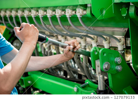 The mechanics repair combine harvester. Modern agricultural machinery 127079133