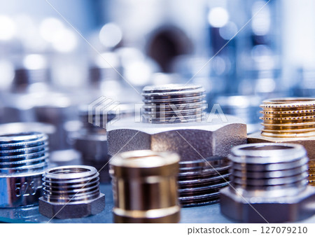 Hosepipe fittings on the table. Plumbing pipeline spare parts. Hosepipe fittings on the table. Plumbing pipeline spare parts. 127079210