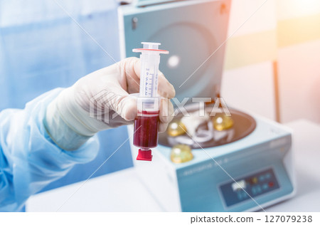 Platelet-Rich plasma preparation. Plasma in syringe. Centrifuge. Platelet-Rich plasma preparation. Plasma in syringe. Centrifuge. 127079238