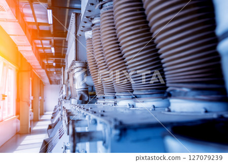 Interior of modern natural oil factory. The piping, pumps and motors Interior of modern natural oil factory. The piping, pumps and motors 127079239