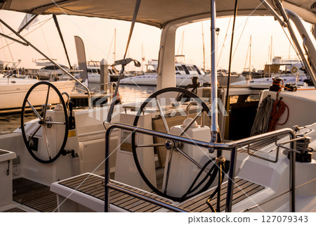 A modern speed boat yacht steering wheels. A modern speed boat yacht steering wheels. 127079343