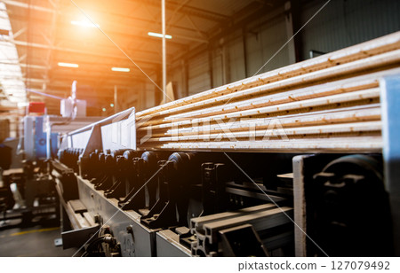 Production line of the wooden floor factory. CNC automatic woodworking machine. 127079492