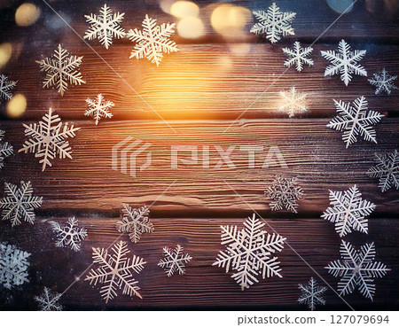 Christmas background with snowflakes on a wooden background with bokeh effect. AI Generated. 127079694