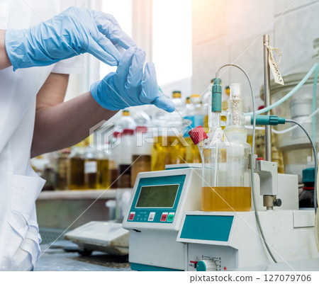 Natural oil quality control. In the industrial laboratory. 127079706