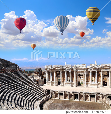 Air balloons and theater in ancient Hierapolis, Pamukkale, Anatolia, Turkey. Topic of vacation, travel, trip abroad, cruises and tours. Balloon flight, famous tourist attraction of Pamukkale 127079758