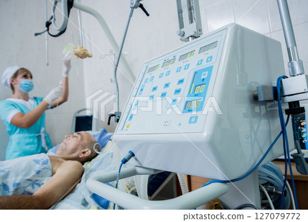 Doctor give resuscitation to patient in the emergency room. Cardiac massage 127079772