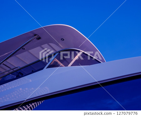 View of harbor with yachts details. Beautiful sunset sky in the marina bay. 127079776