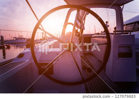 A modern speed boat yacht steering wheels. 127079883