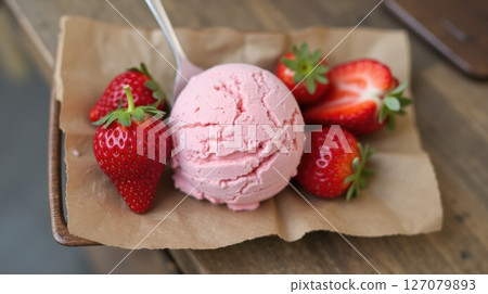 strawberry ice cream on wood background 127079893
