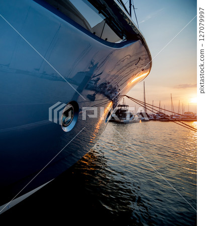 View of harbor with yachts details. Beautiful sunset sky in the marina bay. View of harbor with yachts details. Beautiful sunset sky in the marina bay. 127079997