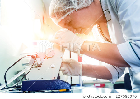 Natural oil quality control. In the industrial laboratory. Natural oil quality control. In the industrial laboratory. 127080070