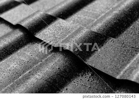Gray metallic roof tiles background with light pattern. 127080143