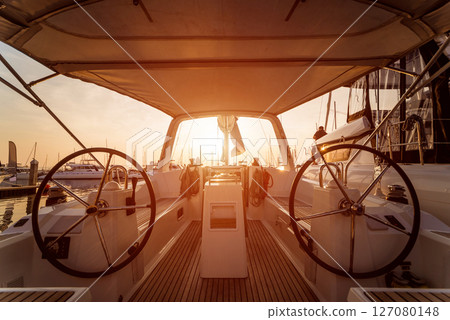 A modern speed boat yacht steering wheels. 127080148