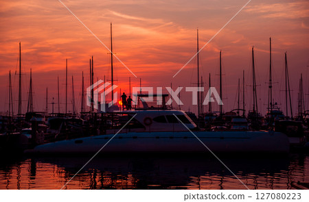 Beautiful view of marina and harbor with yachts and motorboats. Beautiful view of marina and harbor with yachts and motorboats. 127080223