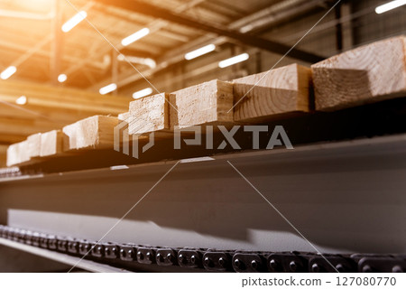 Production line of the wooden floor factory. CNC automatic woodworking machine. 127080770