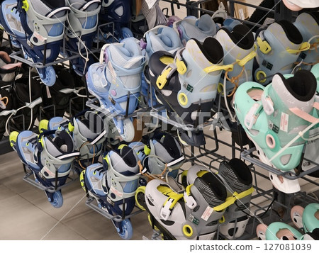 Colorful roller skates are stacked neatly, creating an interesting display 127081039
