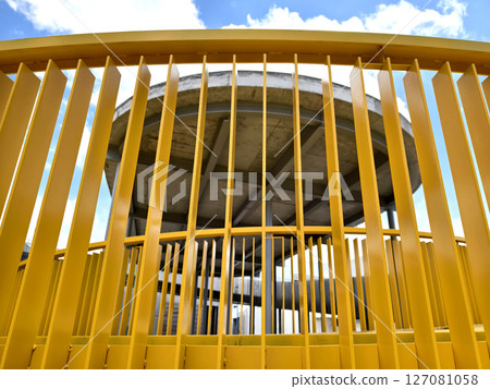 A large and impressive modern building is under construction. 127081058