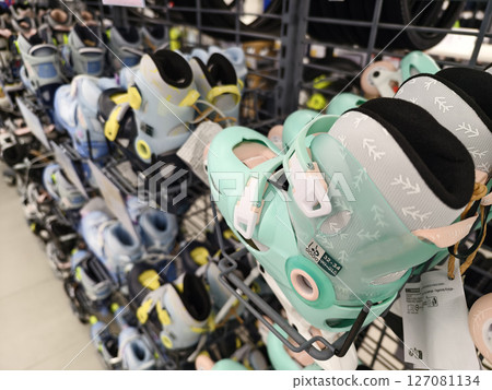 Colorful roller skates are stacked neatly, creating an interesting display 127081134
