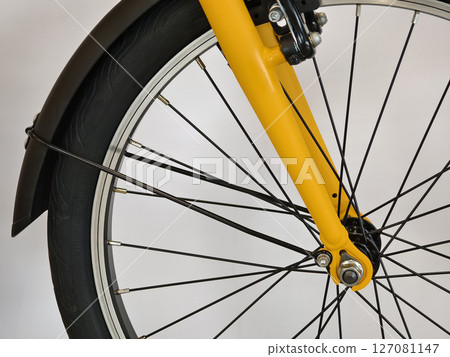 A variety of bicycles are hanging on a rack inside a sport store A variety of bicycles are hanging on a rack inside a sport store 127081147