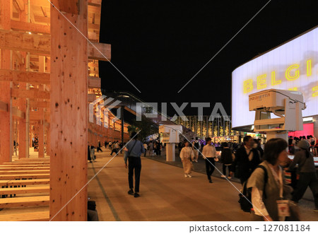 Night crowds and the large roof ring in front of the Belgian Pavilion at the EXPO 2025 Osaka Kansai Expo 127081184