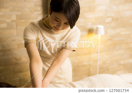 Senior woman receiving massage at beauty salon Senior woman receiving massage at beauty salon 127081734