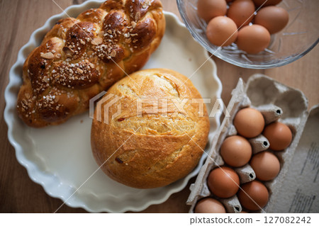 Homemade bread and eggs on rustic kitchen table Homemade bread and eggs on rustic kitchen table 127082242