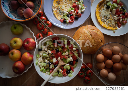 Omelet with Greek salad and fresh bread 127082261