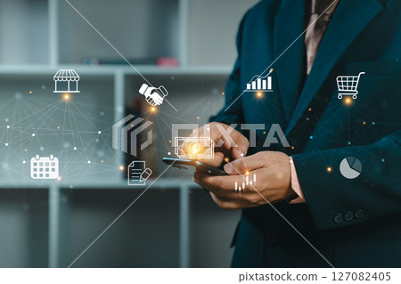 Businessman using a smartphone for control business management and network technology. Network structure and business icons. Business people is working. Businessman using a smartphone for control business management and network technology. Network structure and business icons. Business people is working. 127082405
