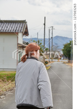 Woman gazing into the distance in nature 127083263