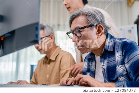 Asian Instructor Teaching Senior in Software Programming and Training Collaboration 127084378