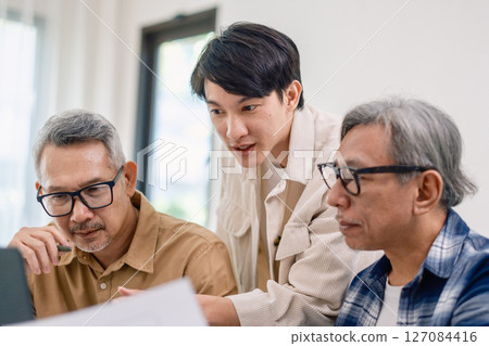 Asian Instructor Teaching Senior in Software Programming and Training Collaboration Asian Instructor Teaching Senior in Software Programming and Training Collaboration 127084416