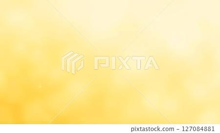 Dreamy soft yellow blurry abstract background with gentle hazy lights and subtle floating elements 127084881