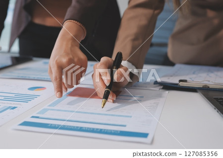 Accounting company provide finance and taxation planning for profitable cash flow, Auditor and accountant team working in office, analyze financial data and accounting record with calculator.Insight Accounting company provide finance and taxation planning for profitable cash flow, Auditor and accountant team working in office, analyze financial data and accounting record with calculator.Insight 127085356