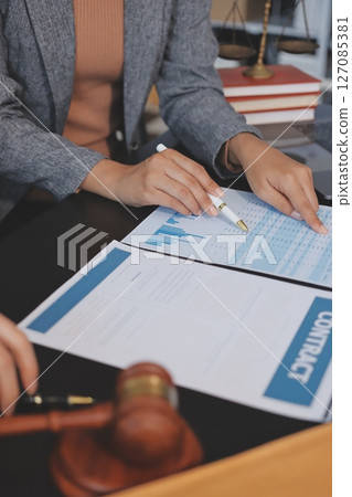 Judge gavel with Justice lawyers having team meeting at law firm background. Concepts of Law and Legal services. Judge gavel with Justice lawyers having team meeting at law firm background. Concepts of Law and Legal services. 127085381