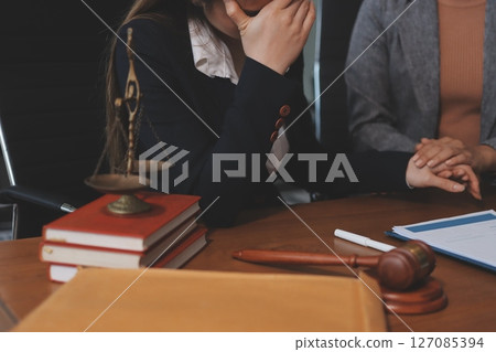 Judge gavel with Justice lawyers having team meeting at law firm background. Concepts of Law and Legal services. Judge gavel with Justice lawyers having team meeting at law firm background. Concepts of Law and Legal services. 127085394