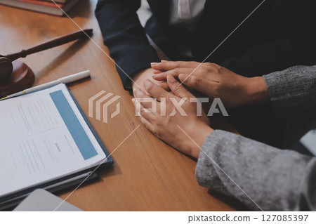 Judge gavel with Justice lawyers having team meeting at law firm background. Concepts of Law and Legal services. Judge gavel with Justice lawyers having team meeting at law firm background. Concepts of Law and Legal services. 127085397