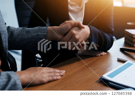 Judge gavel with Justice lawyers having team meeting at law firm background. Concepts of Law and Legal services. 127085398