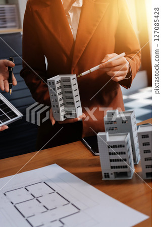 Discussion among businesspeople on the latest developments in solar cell panel technology and Solar Energy Environment city Concept. 127085428