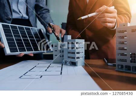 Discussion among businesspeople on the latest developments in solar cell panel technology and Solar Energy Environment city Concept. Discussion among businesspeople on the latest developments in solar cell panel technology and Solar Energy Environment city Concept. 127085430