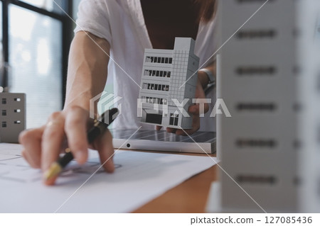 Discussion among businesspeople on the latest developments in solar cell panel technology and Solar Energy Environment city Concept. 127085436