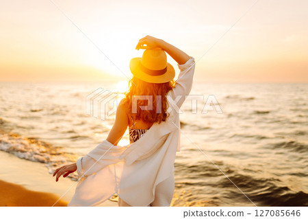 Happy woman on beach in summer style fashion trend outfit carefree and happy, feeling freedom. 127085646
