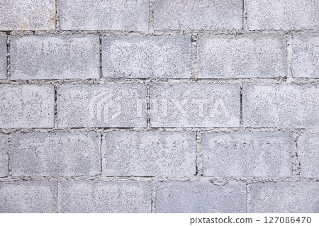 Concrete block wall background in horizontal composition. 127086470