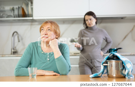 Frustrated mature woman after a conflict with her daughter 127087044
