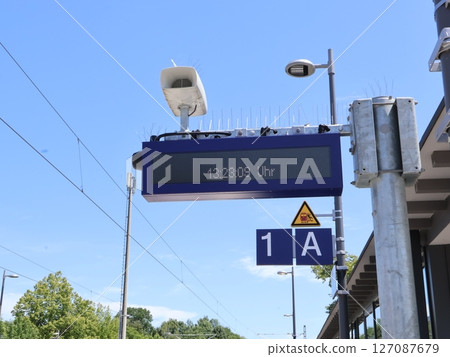 Digital Display Showing Time at an Outdoor Railway Station Platform 127087679