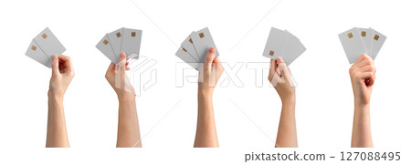 Bank card mockup set. Female hand holding two or three blank gold cards with chip for credit, debit, Bank card mockup set. Female hand holding two or three blank gold cards with chip for credit, debit, 127088495