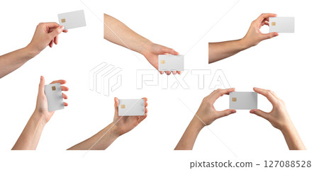 Bank card mockup in hand. Female fingers holding blank gold credit or debit card for pay, online 127088528